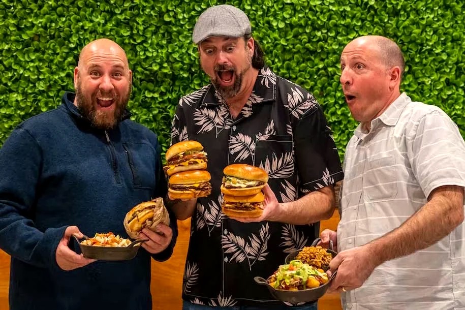 Chris, Chad and Rev, the founders, with an armful of Handcraft burgers and sides